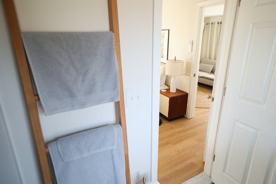 view from the bathroom through the bedroom to the living area.
