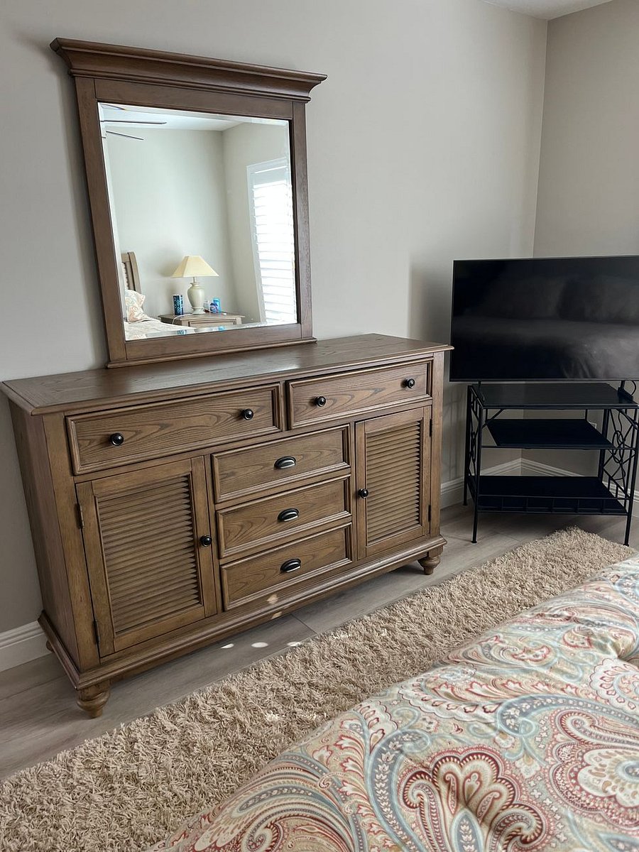 Master bedroom dresser, smart TV.