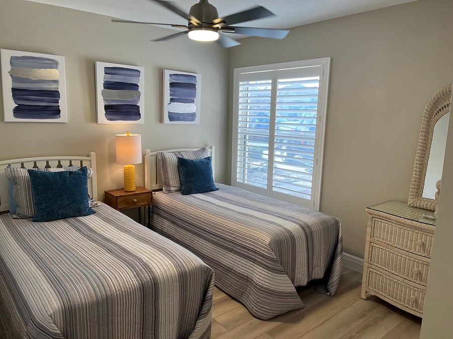 Guest bedroom with 2 twin beds, comfy mattresses, closet.