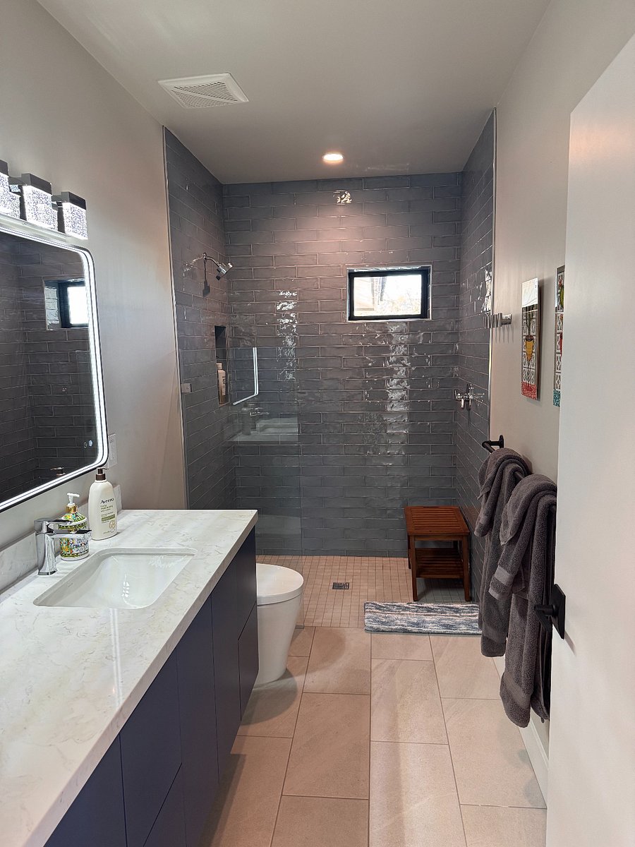 The casita boasts a luxury bathroom featuring sensory operated commode and beautiful walk-in shower. 