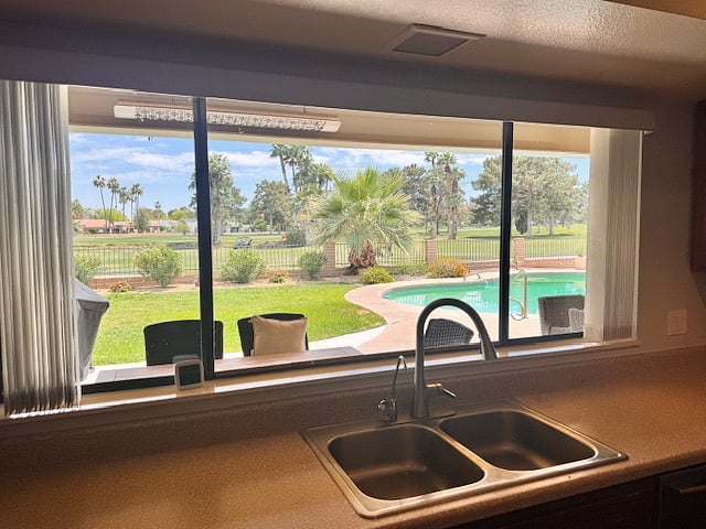 Nice large windows overlooking the pool and golf course. 