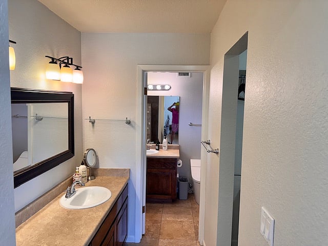 Full master bathroom with walk-in shower and ample storage. 