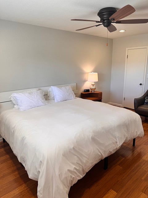 Guest bedroom features a king sized bed that can be separated into 2 twin sized beds.