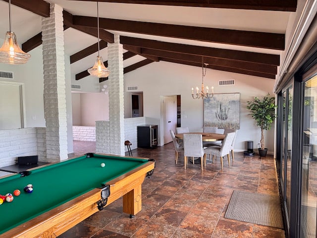 Billiards and dining overlooking a pristine golf course and beautiful in ground pool. 