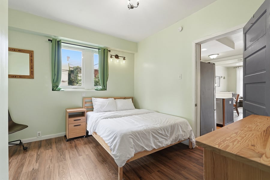 First floor bedroom; full sized dresser below the camera