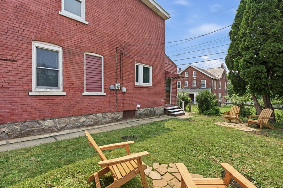 Fenced backyard with outdoor seating