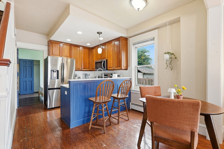 Kitchen and dining room with bar setup