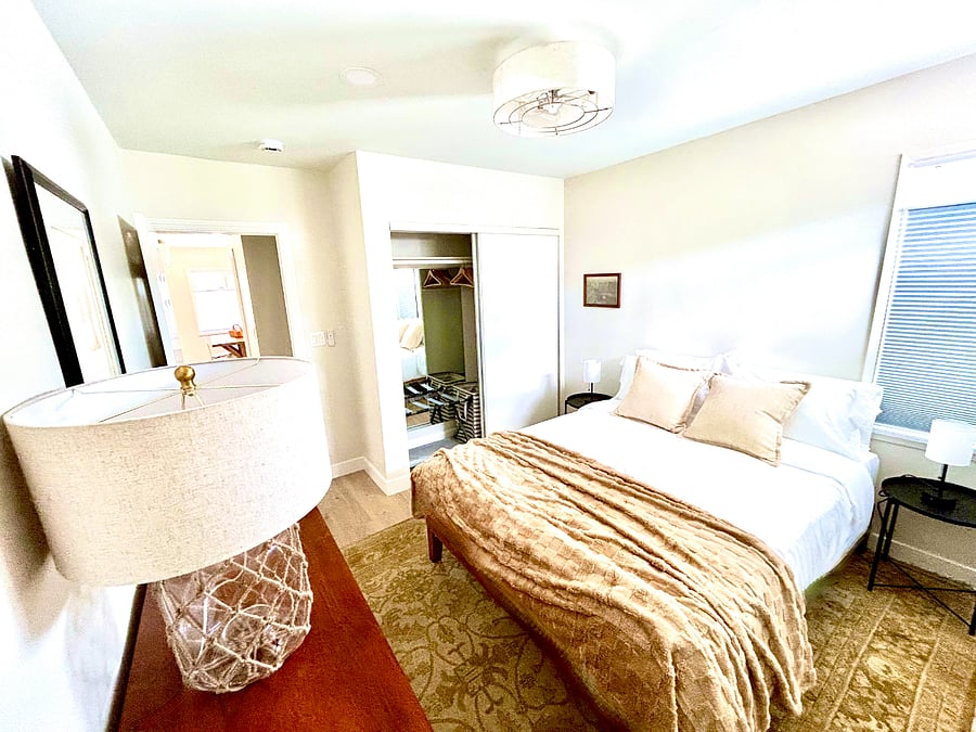 There's plenty of clothing storage for longer stays in the queen bedroom, its own heat+AC, and a smart TV.