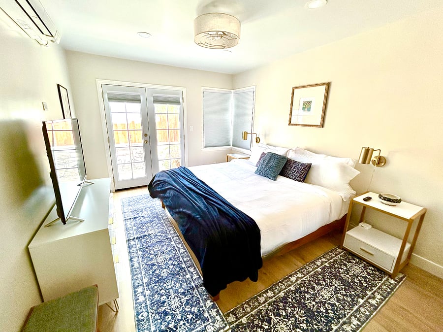 The beautiful king suite has a new Casper bed, a smart TV, blackout shades and French doors to the backyard.