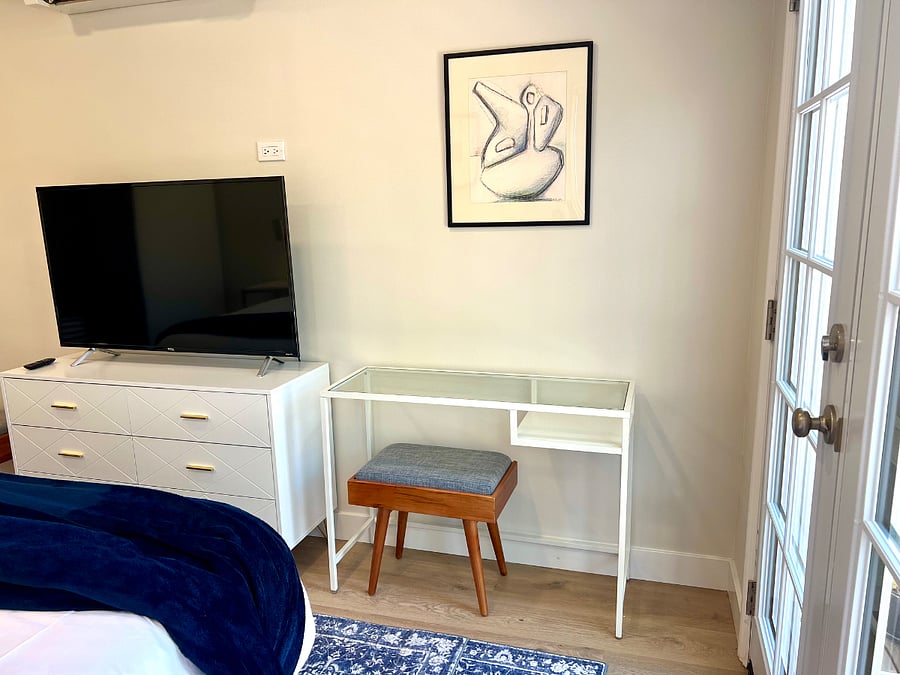 The king suite has a small workspace with backyard views.
