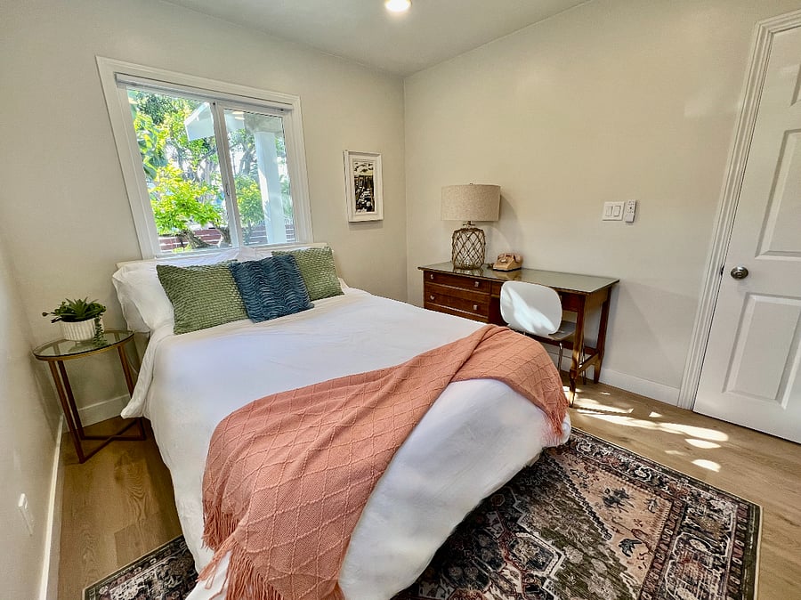The full bedroom has a full/double Casper bed, its own heat+AC and garden views.