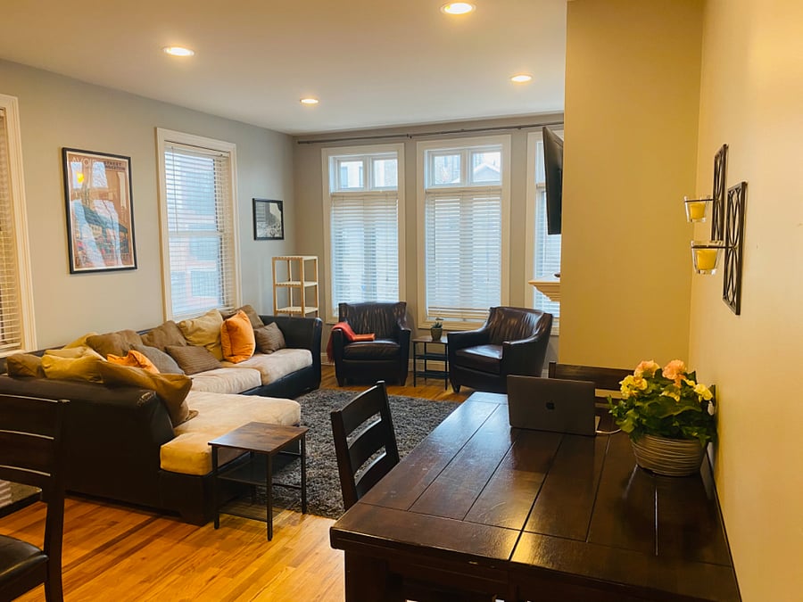 Living room with 2 leather chairs added and kitchen hightop table