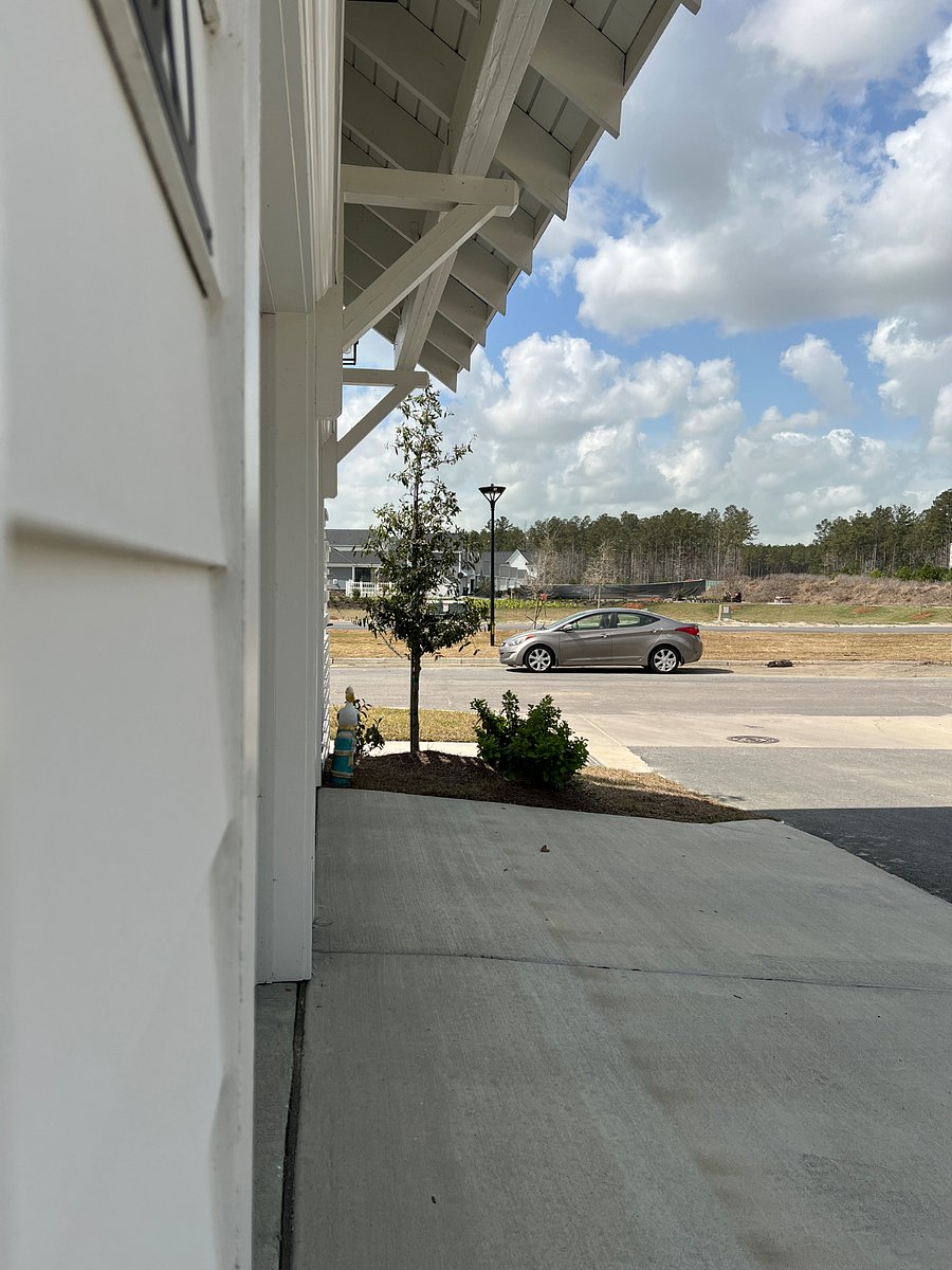 This picture is from the bottom of stairs to parking a few steps away. The car is our sons. We will move it before your arrival but serves as a good indicator of where parking is. There are plenty of spaces over there.