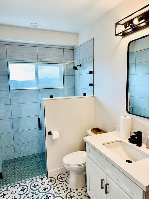Full, modern bath with mountain views
