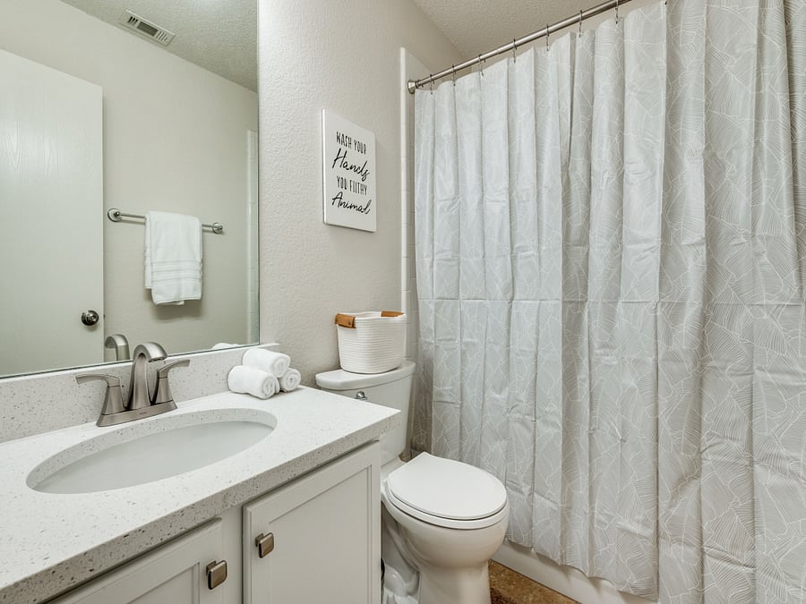 Private bath in between the bedroom and office/lounge 