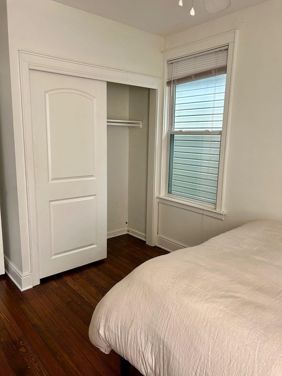 Smaller bedroom closet, second window facing the side of the house