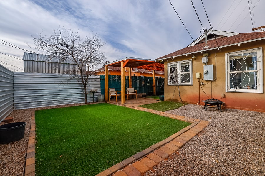 Spacious turf area, covered seating area and firepit