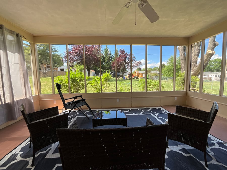 Outdoor patio with second gravity chair and waterproof curtains for maximum, private relaxing