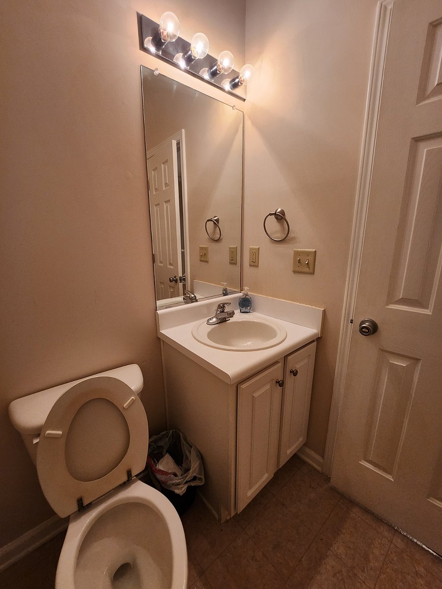 A photo of the shared half-bath.