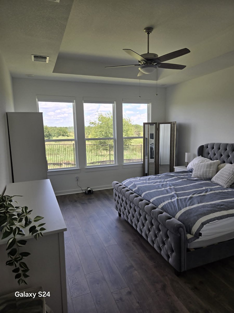 Master bedroom with King size super comfortable plush bed, where's the hallway?gorgeous views of nature, and you can see amazing sunrises each day!