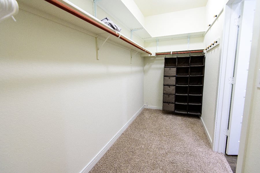 Generous walk-in closet with hanging space and shelving,  plenty of room for a longer stay.
