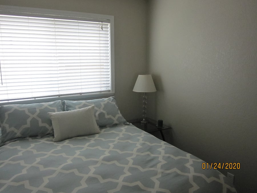 Bedroom with very comfortable queen bed and window now has shutters.