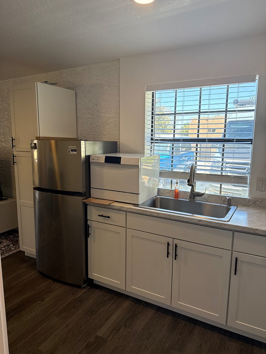 Kitchen on main level. Countertop dishwasher can be removed if you dont want/need it. To use it, you attach it to the sink faucet. 