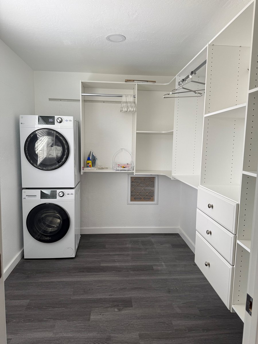 Upstairs closet with washer/dryer attached to the bedroom 