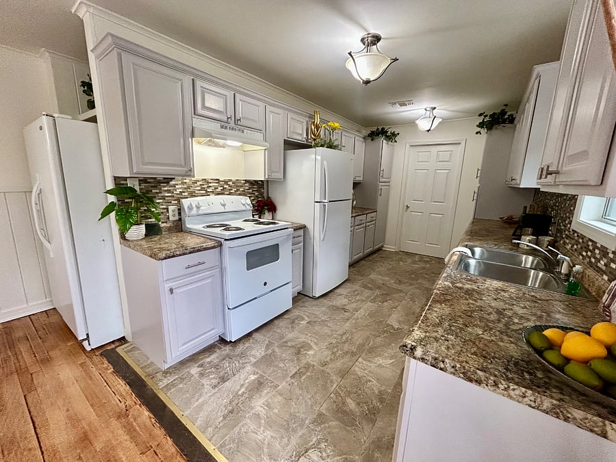 Renovated kitchen with two large refrigerators (great when house sharing) and other new appliances.