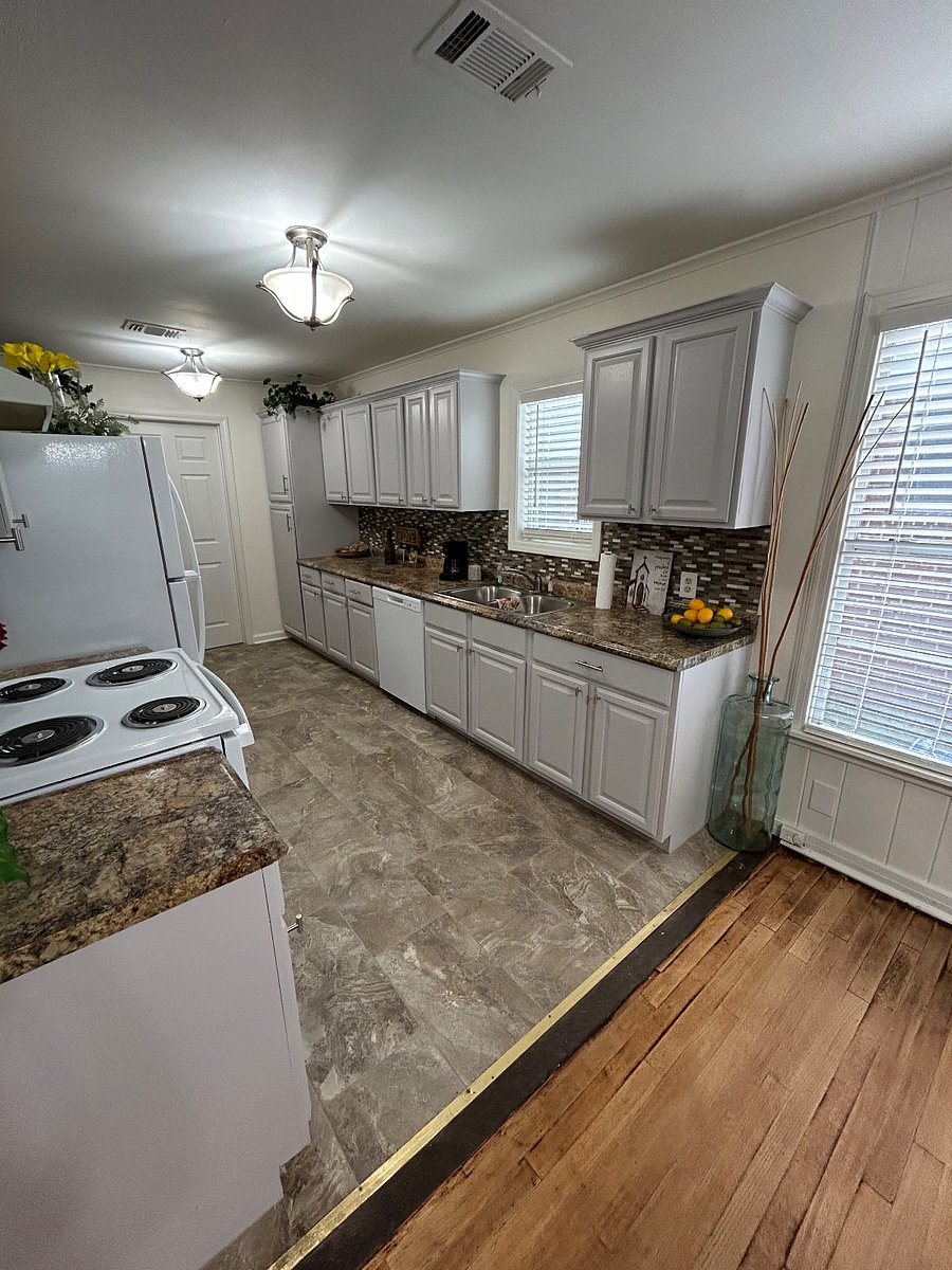 Renovated kitchen with two large refrigerators (great when house sharing), dishwasher and other new appliances.