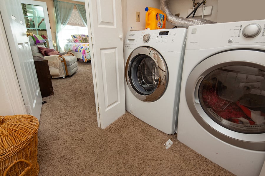 Washer/dryer located upstairs in the hallway.
