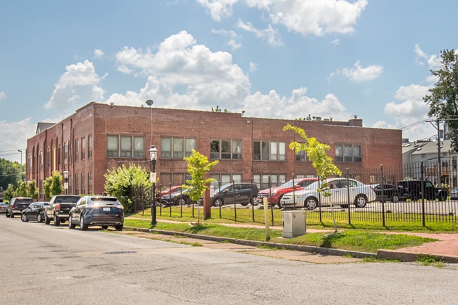 Exterior of building and gated parking