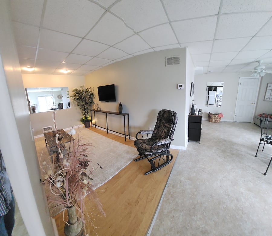 Living Room with electric reclining leather sofa and big screen TV