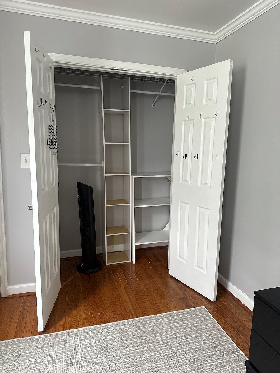 Primary bedroom closet with organizer