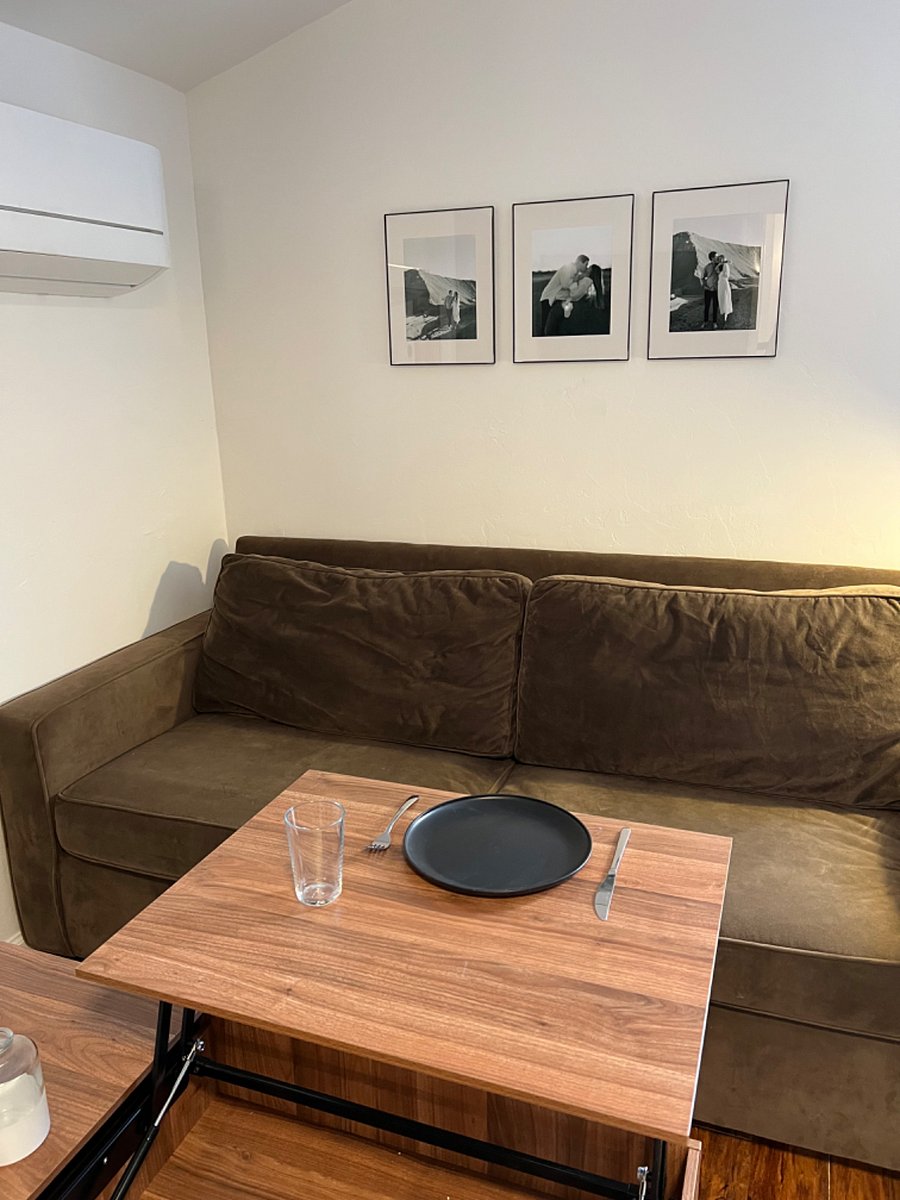 The coffee table pulls up into a table.