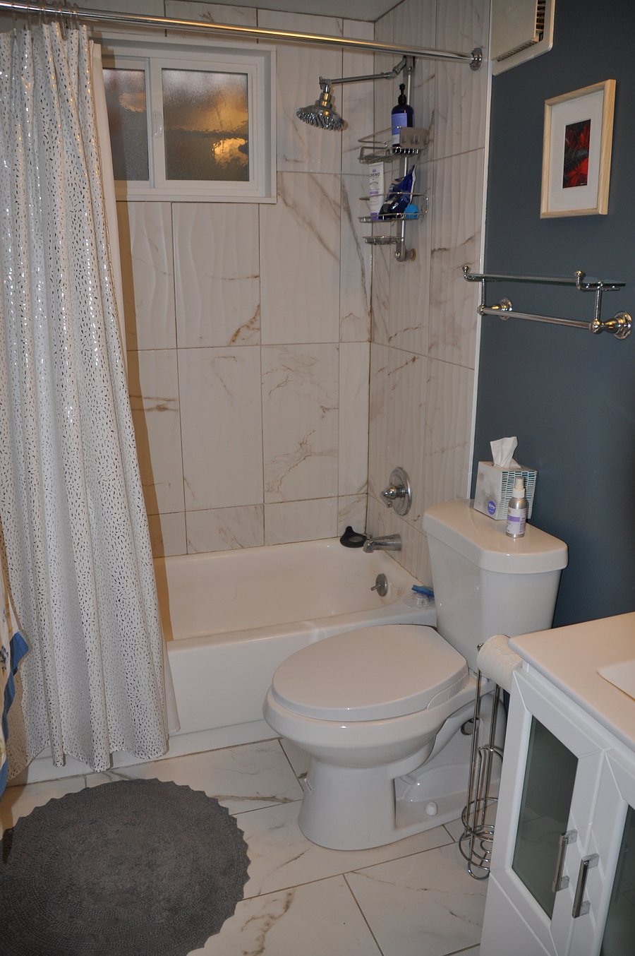 Private bath with rain shower and tub.