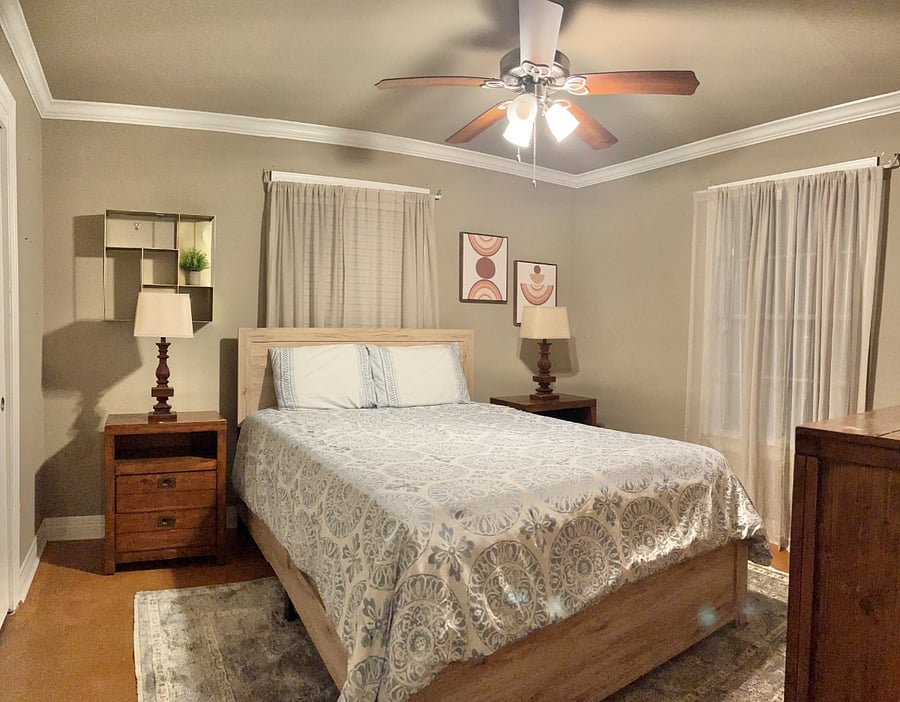 1st level bedroom w/ queen bed and work space
