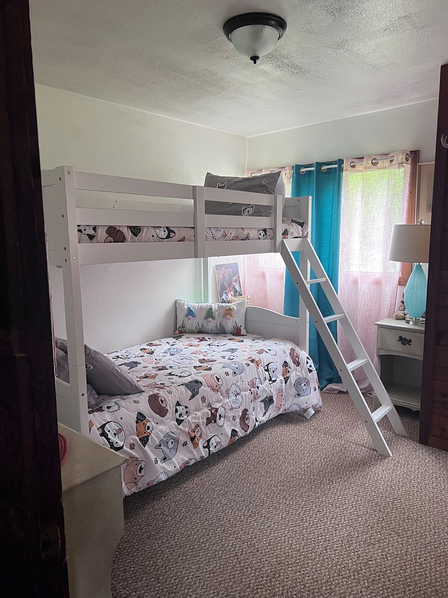 Downstairs small bedroom with tv