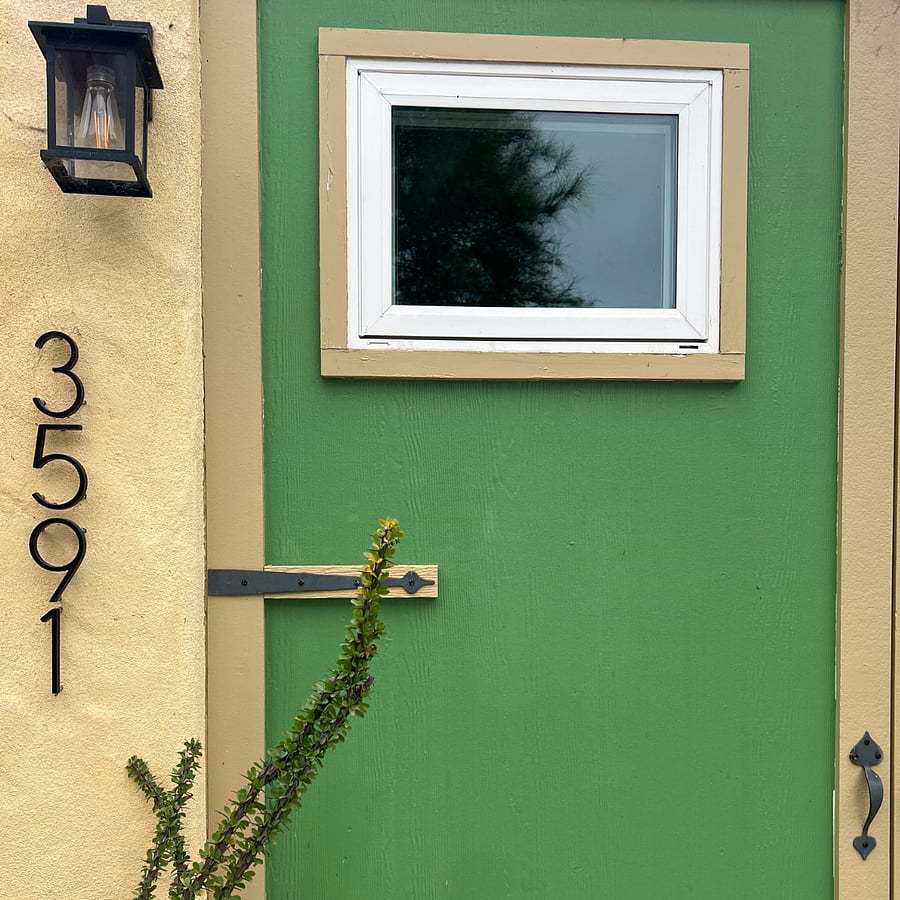 Separate Address and Mailbox for the Casita. Faux Garage Doors preserve the look of the original structure.