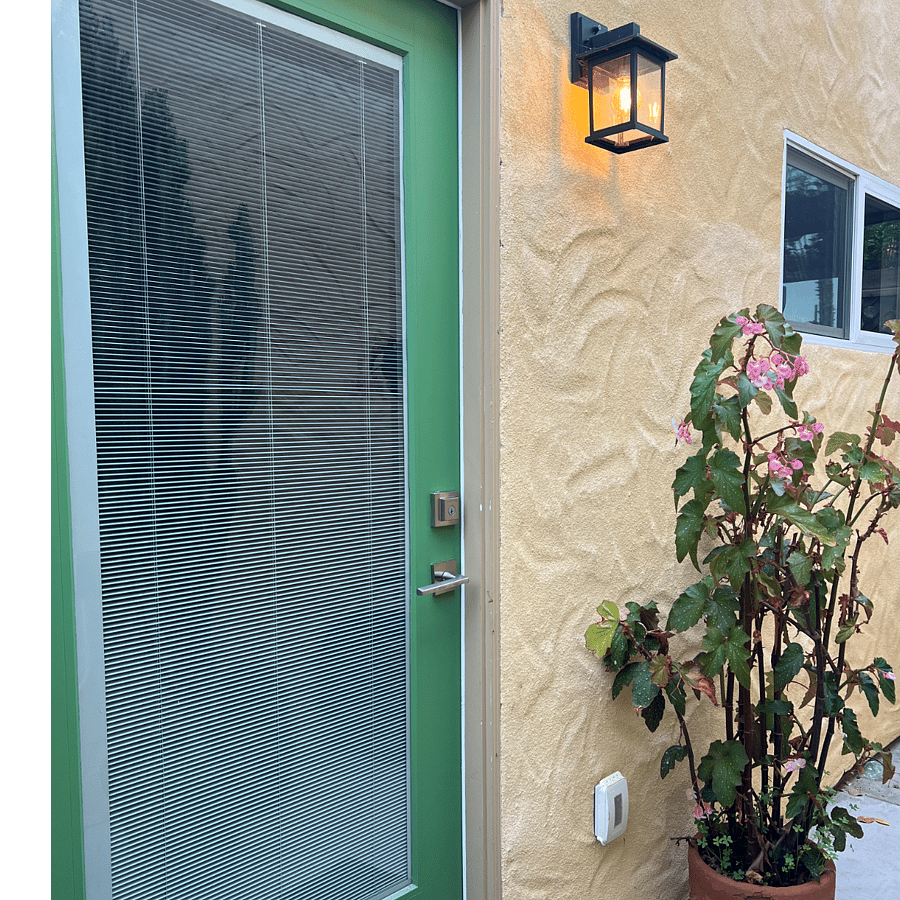 Private Entry door with unique Venetian blinds builtin to the Door glass for light and Privacy.