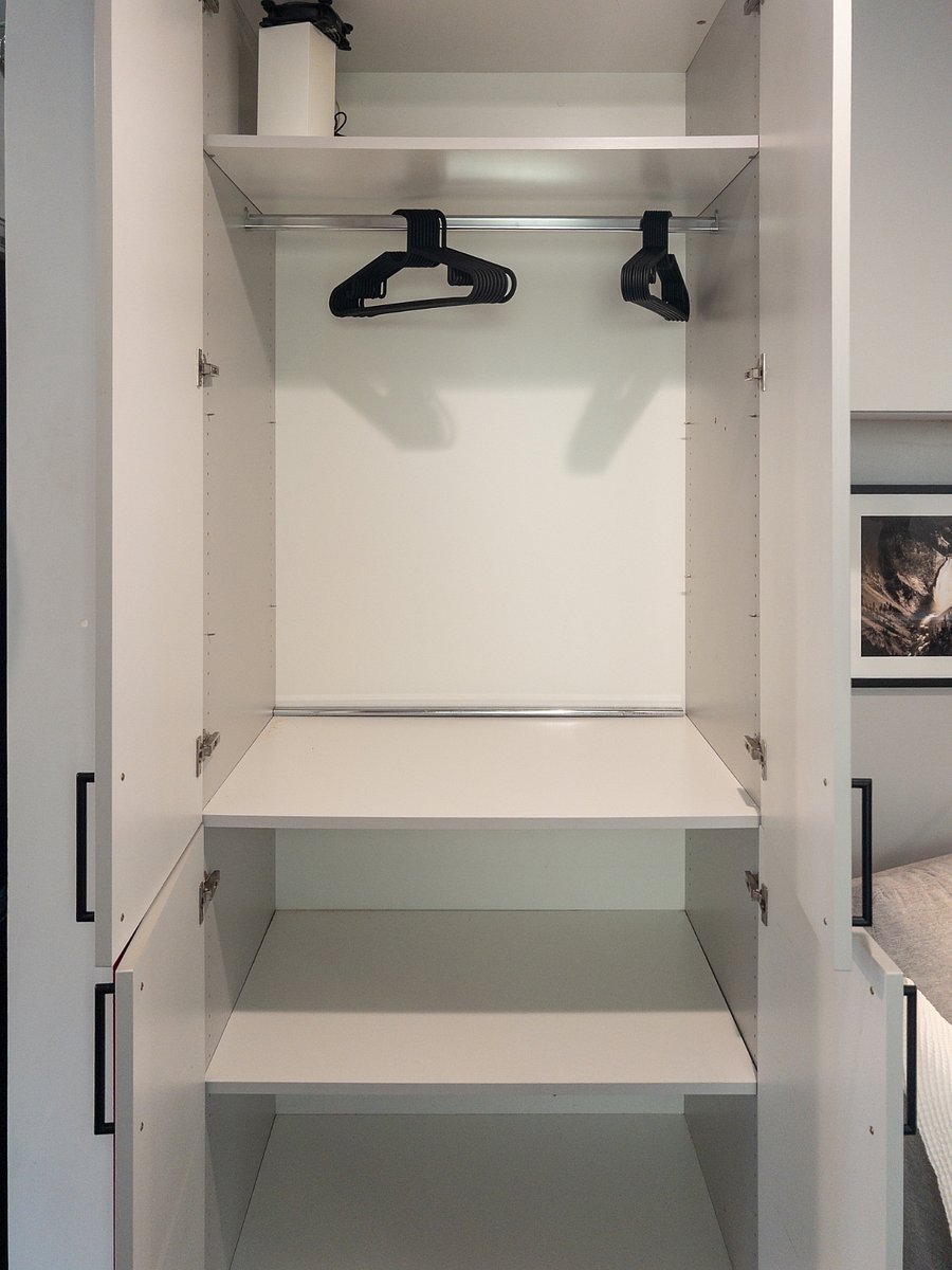 Living-room has a spacious Clothes Armoire, Shelving, High-Speed Internet with Broadband and WiFi 6 Networking Equipment