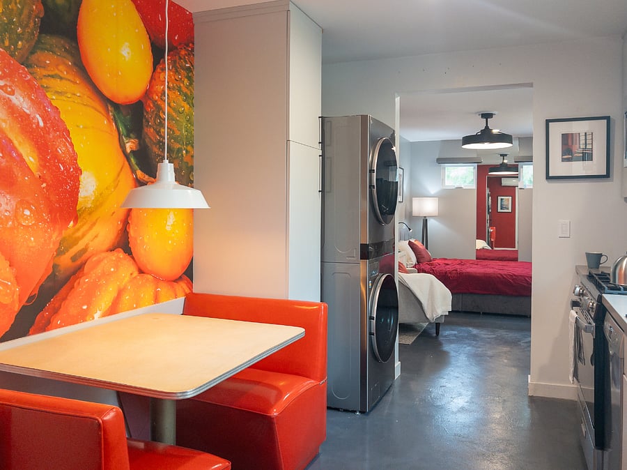 Kitchen Dinette workspace and Stainless Steel Stacked LG Washer Dryer Tower and Laundry Hamper closet and storage.