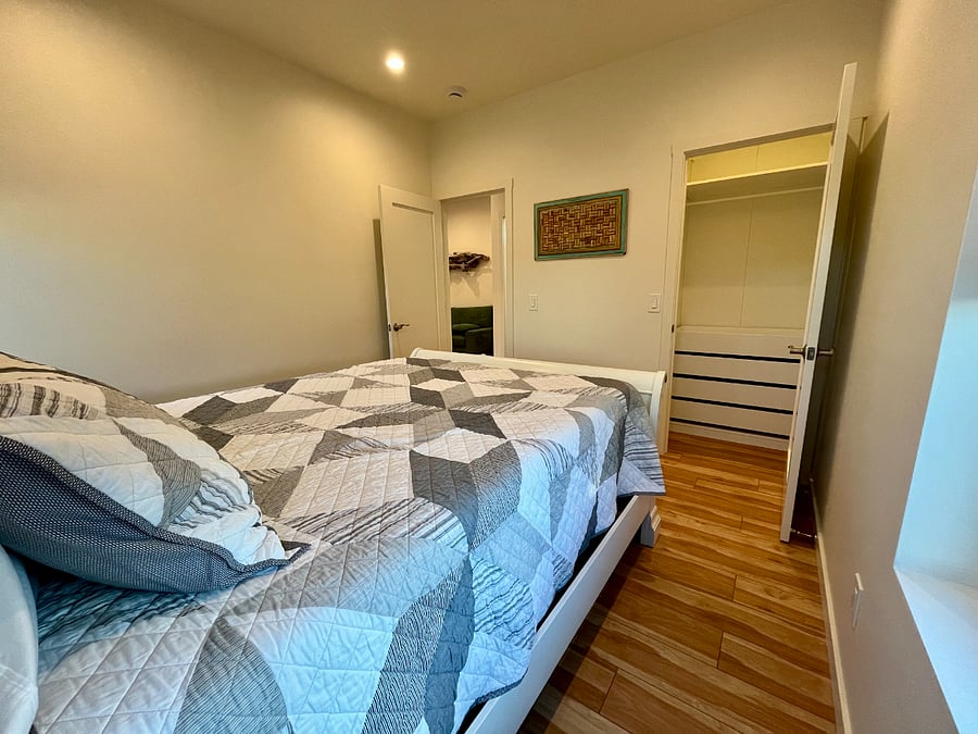 Bedroom with blackout curtains and closet