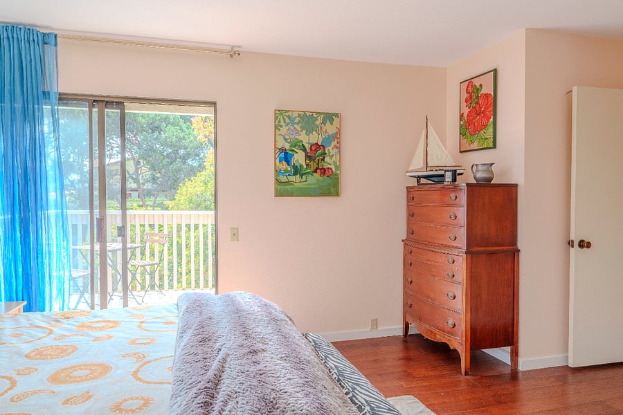 Primary bedroom looking toward deck
