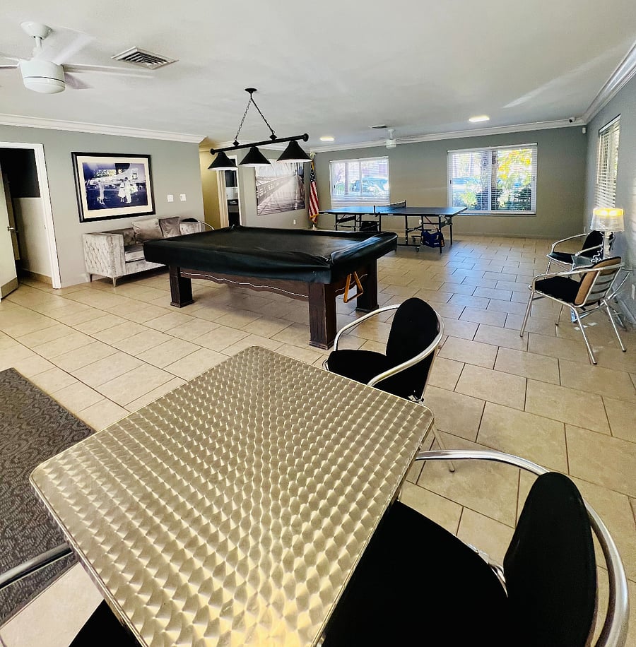Clubhouse pool, ping pong, and game tables. 