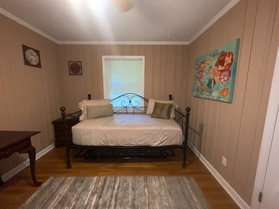 Room Number 1 is directly off of the kitchen. Pictures featuring a day bed (twin), a desk and small dresser. This qualifies as a child's room.