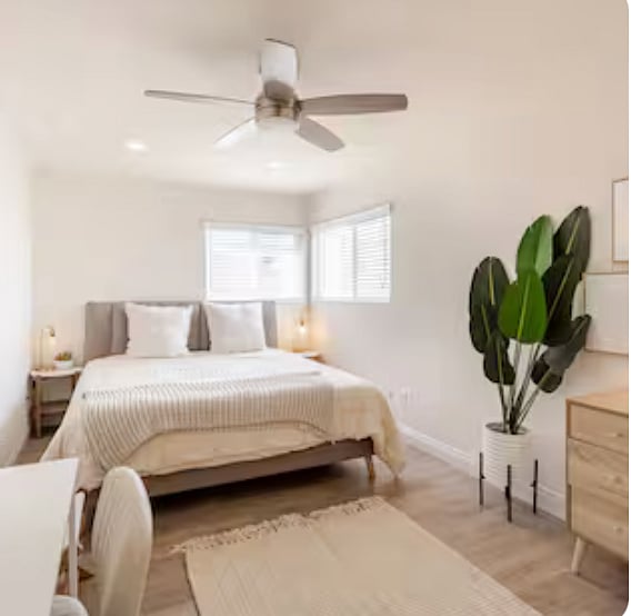 Back Bedroom - king bed, closet, two nightstands, Chester drawers, and desk with rolling chair