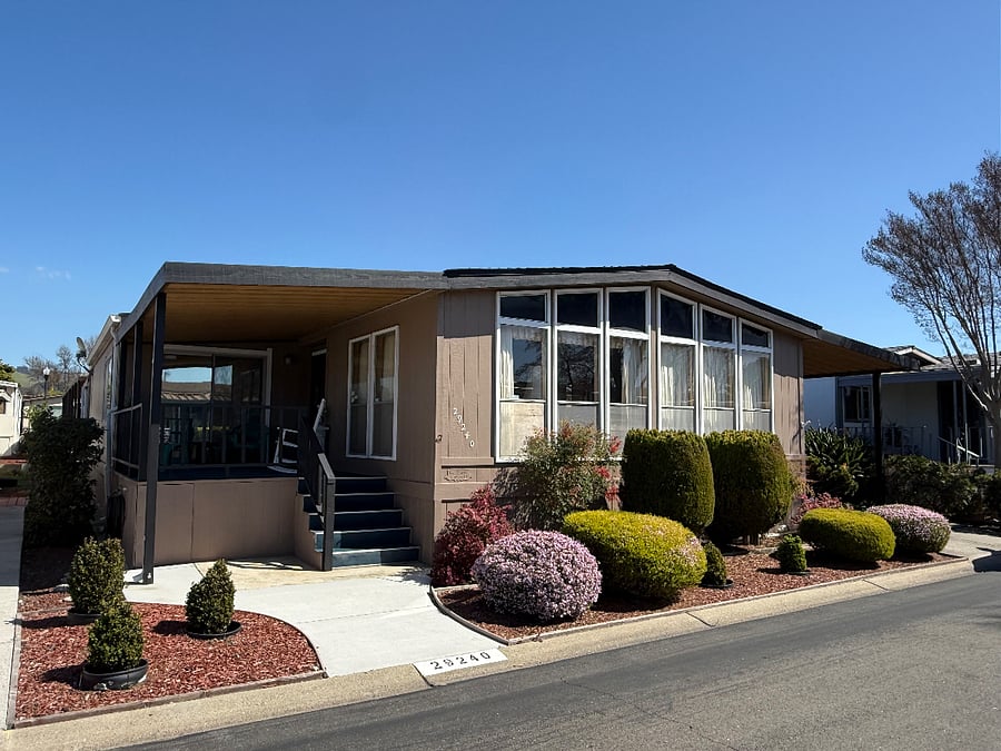 The carport is on the right side, which you would have access to using.