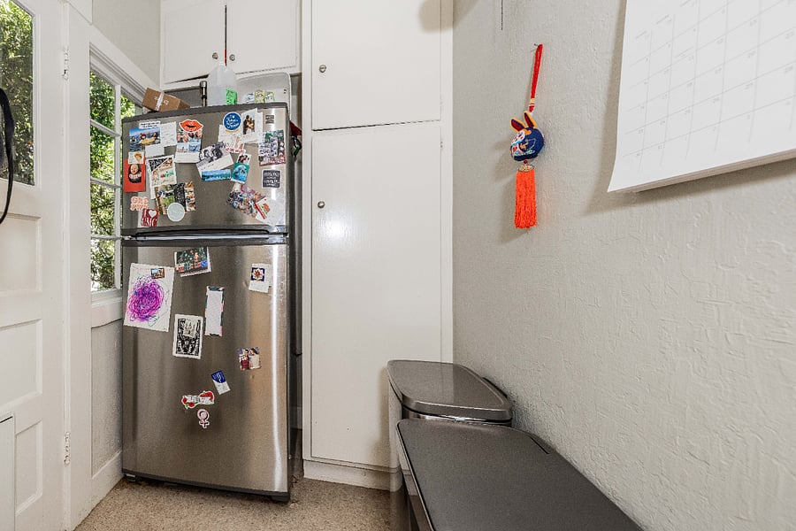 kitchen nook with fridge and microwave