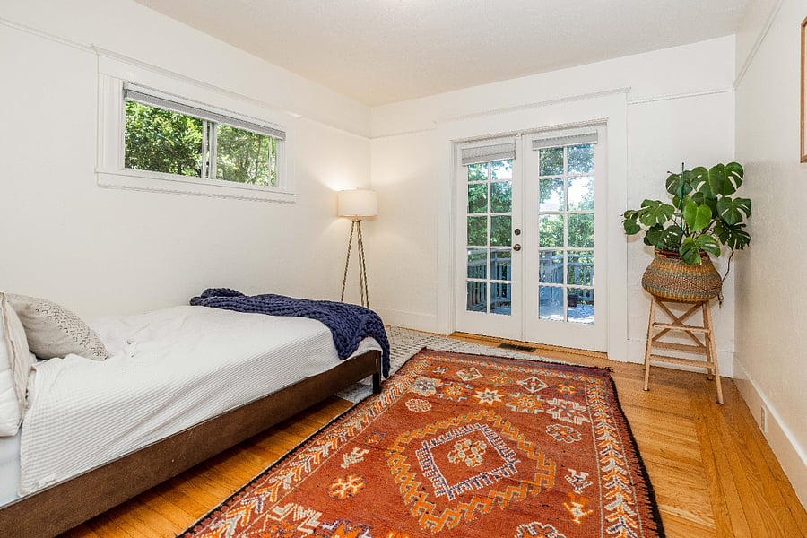 bedroom 1 with access to backyard